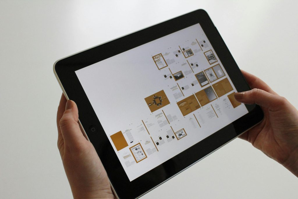 person-holding-black-ipad