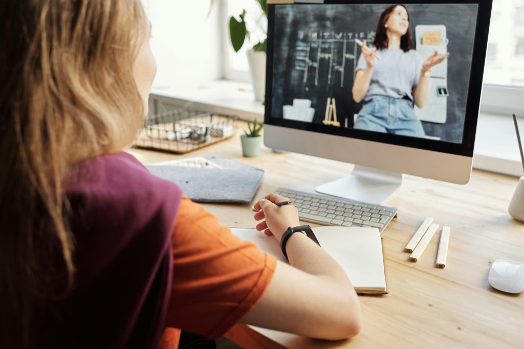 photo-of-girl-watching-through-imac